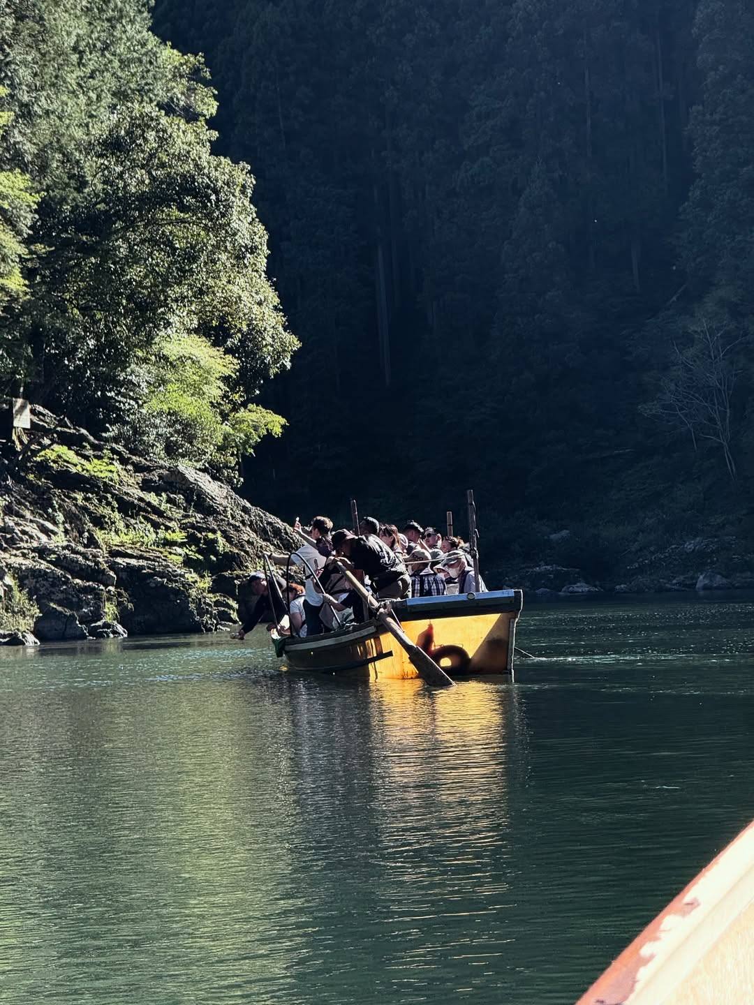boat sailing down the Hozugawa river